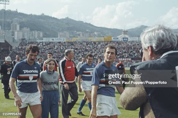 Scottish footballer Graeme Souness pictured on left with teammate Trevor Francis on the pitch after playing for Sampdoria in the Serie A match...