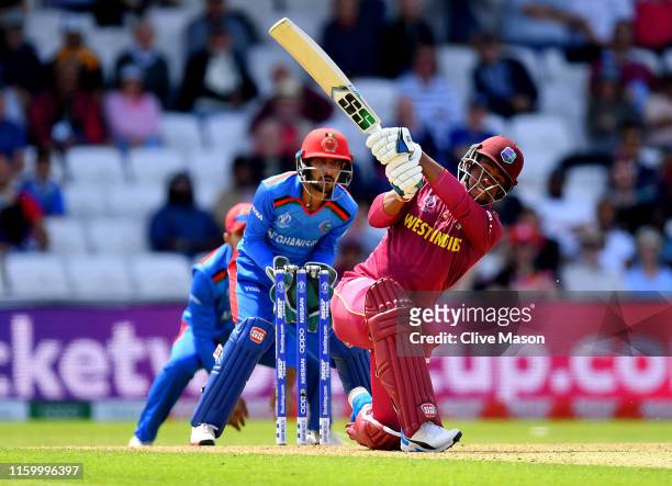 Shimron Hetmyer of West Indies in action batting as Ikram Ali Khil of Afghanistan looks on during the Group Stage match of the ICC Cricket World Cup...