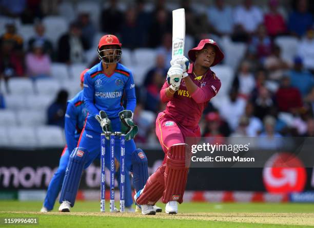 Shimron Hetmyer of West Indies in action batting as Ikram Ali Khil of Afghanistan looks on during the Group Stage match of the ICC Cricket World Cup...