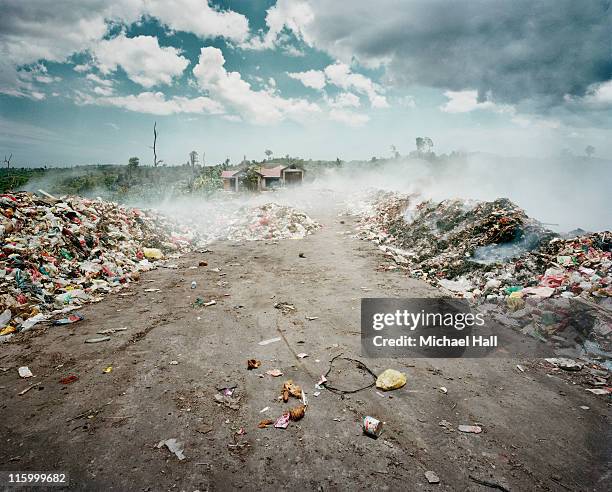 rubbish dump on fire - slag heap stock pictures, royalty-free photos & images