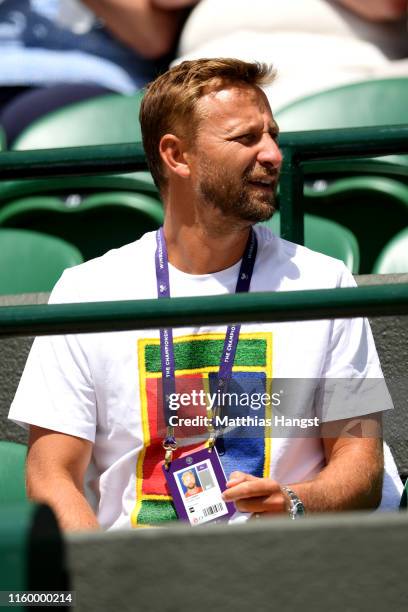 Jiri Vanek, Coach of Petra Kvitova of The Czech Republic watches on ahead of her Ladies' Singles second round match against Kristina Mladenovic of...