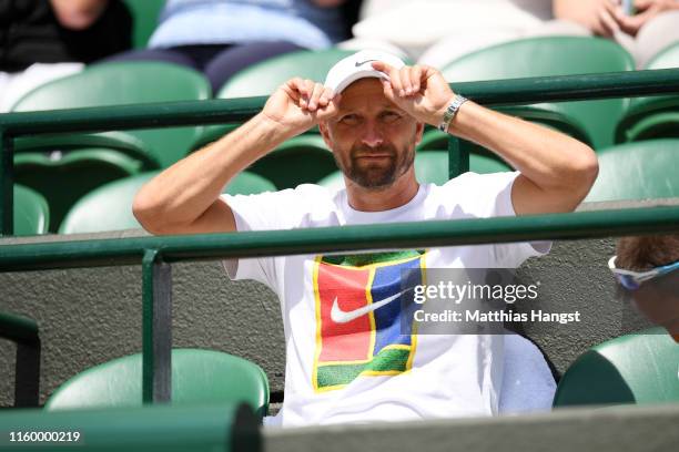 Jiri Vanek, Coach of Petra Kvitova of The Czech Republic watches on ahead of her Ladies' Singles second round match against Kristina Mladenovic of...