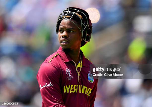 Shimron Hetmyer of West Indies walks off after being dismissed off the bowling of Dawlat Zadran of Afghanistan during the Group Stage match of the...