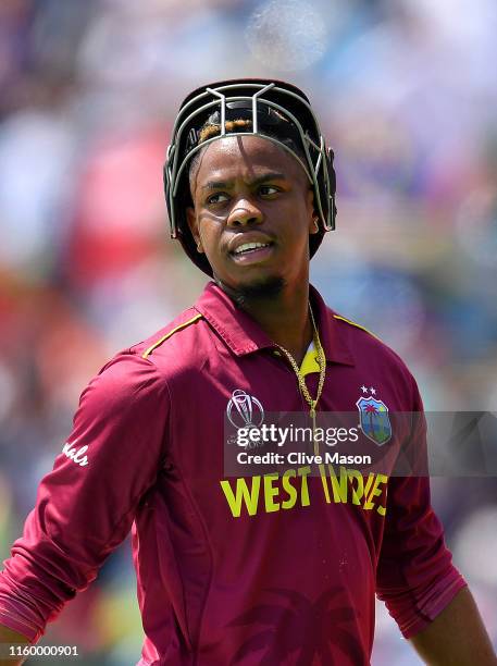 Shimron Hetmyer of West Indies walks off after being dismissed off the bowling of Dawlat Zadran of Afghanistan during the Group Stage match of the...