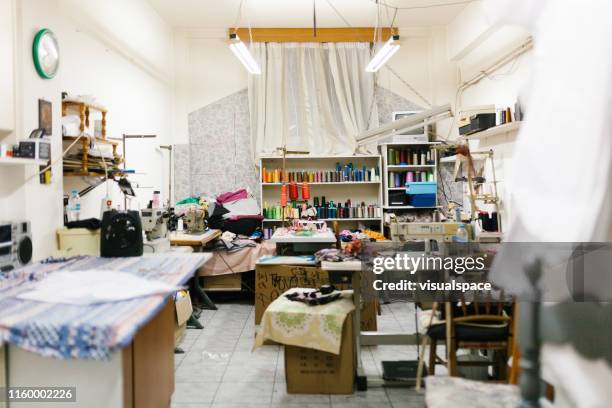 empty room of family sewing and tailoring small business - atelier fashion stock pictures, royalty-free photos & images