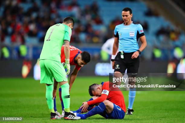 Gary Medel of Chile reacts to a challenge during the Copa America Brazil 2019 Semi Final match between Chile and Peru at Arena do Gremio on July 03,...