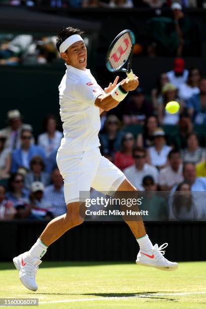 Kei Nishikori of Japan plays a forehand in his Men's Singles second round match against Cameron Norrie of Great Britain during Day four of The...