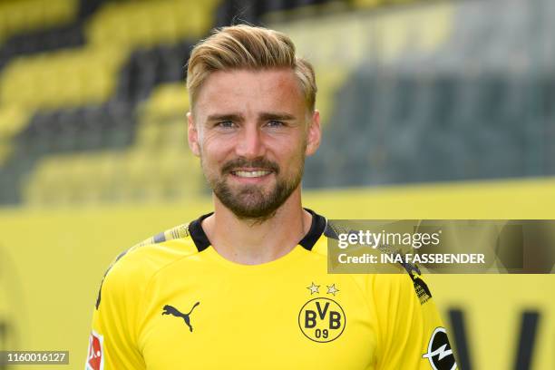 Dortmund's German defender Marcel Schmelzer poses for a photo during the presentation of Borussia Dortmund's squad for the upcoming first Bundesliga...