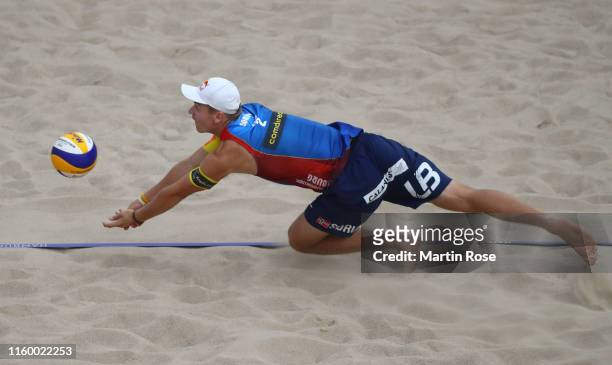 Christian Sorum of Norway in action during the match against Philipp Bergmann and Yannick Harms of Germany on day seven of the FIVB Beach Volleyball...