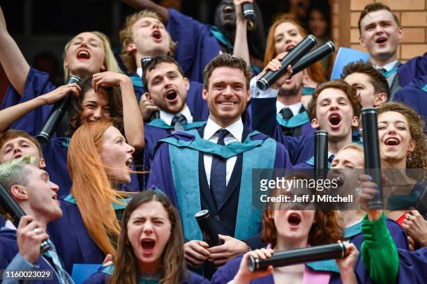 Richard Madden stands on the steps of the Royal Conservatoire of Scotland following receiving an honorary doctorate for his contribution to drama on...