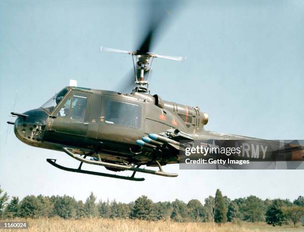 An undated file photo shows a UH-1 Huey helicopter take off while on a training flight. The U.S. Army announced a new aviation modernization plan...