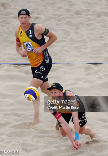 Philipp Bergmann and Yannick Harms of Germany in action against Anders Mol of Norway and Christian Sorum during the match on day seven of the FIVB...