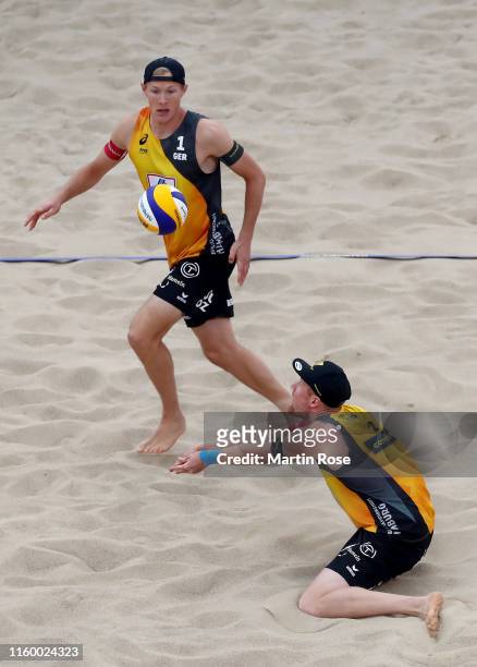 Philipp Bergmann and Yannick Harms of Germany in action against Anders Mol of Norway and Christian Sorum during the match on day seven of the FIVB...