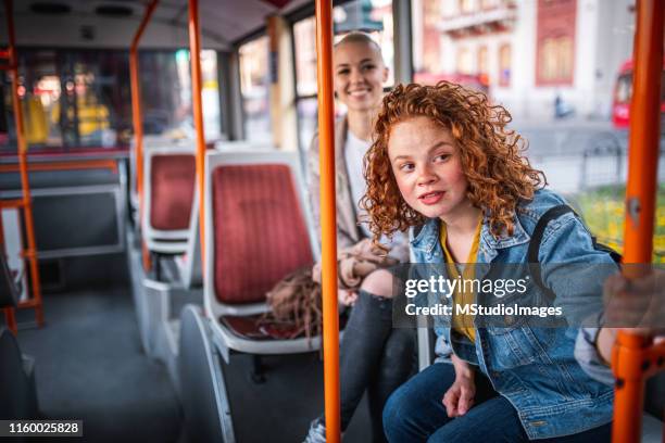 two friends at the bus - looking out bus window stock pictures, royalty-free photos & images