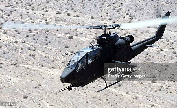 An undated file photo shows an AH-1 Cobra helicopter in flight while on a training mission. The U.S. Army announced a new aviation modernization plan...