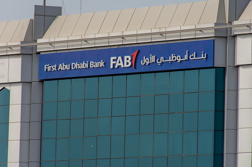 First Abu Dhabi (<a href='https://seekingalpha.com/symbol/FAB' _fcksavedurl='https://seekingalpha.com/symbol/FAB' title='First Trust Multi Cap Value AlphaDEX ETF'>FAB</a>) Bank blue storefront on a blue sky sunny day