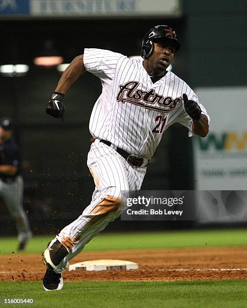 Michael Bourn of the Houston Astros scores in the sixth inning on a Hunter Pence single against the Atlanta Braves at Minute Maid Park on June 13,...