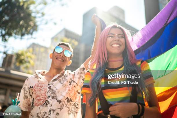 group of friends enjoying the lgbtqi parade - lgbtqi pride event stock pictures, royalty-free photos & images