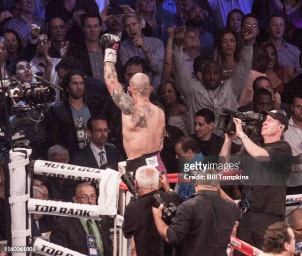 June 7: MANDATORY CREDIT Bill Tompkins/Getty Images Miguel Cotto raises his arm in victory over Sergio Martinez in their world middleweight boxng...