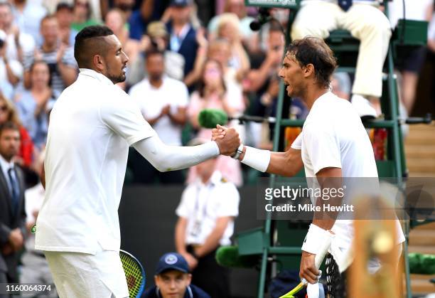 Rafael Nadal of Spain shakes hands at the net with Nick Kyrgios of Australia after their Men's Singles second round match during Day four of The...