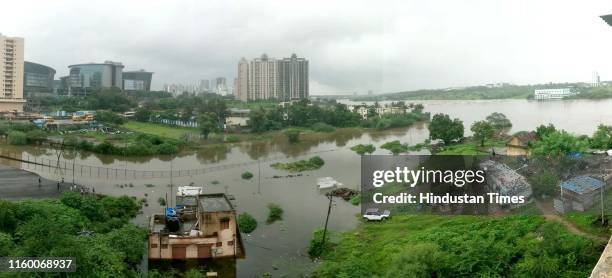 Pathway from Kharadi Gaon to Mundhwa Jackwell has been submerged due to rain on August 5, 2019 in Pune, India. Low-lying areas in the district were...