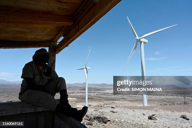 Security man guards the turbines at the Lake Turkana Wind Power, on August 6, 2019 in Loiyangalani District, in Marsabit County, approximately 545...