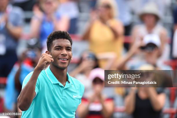 Felix Auger-Aliassime of Canada celebrates his 6-2, 6-7, 7-6 victory against Vasek Pospisil of Canada during day 5 of the Rogers Cup at IGA Stadium...