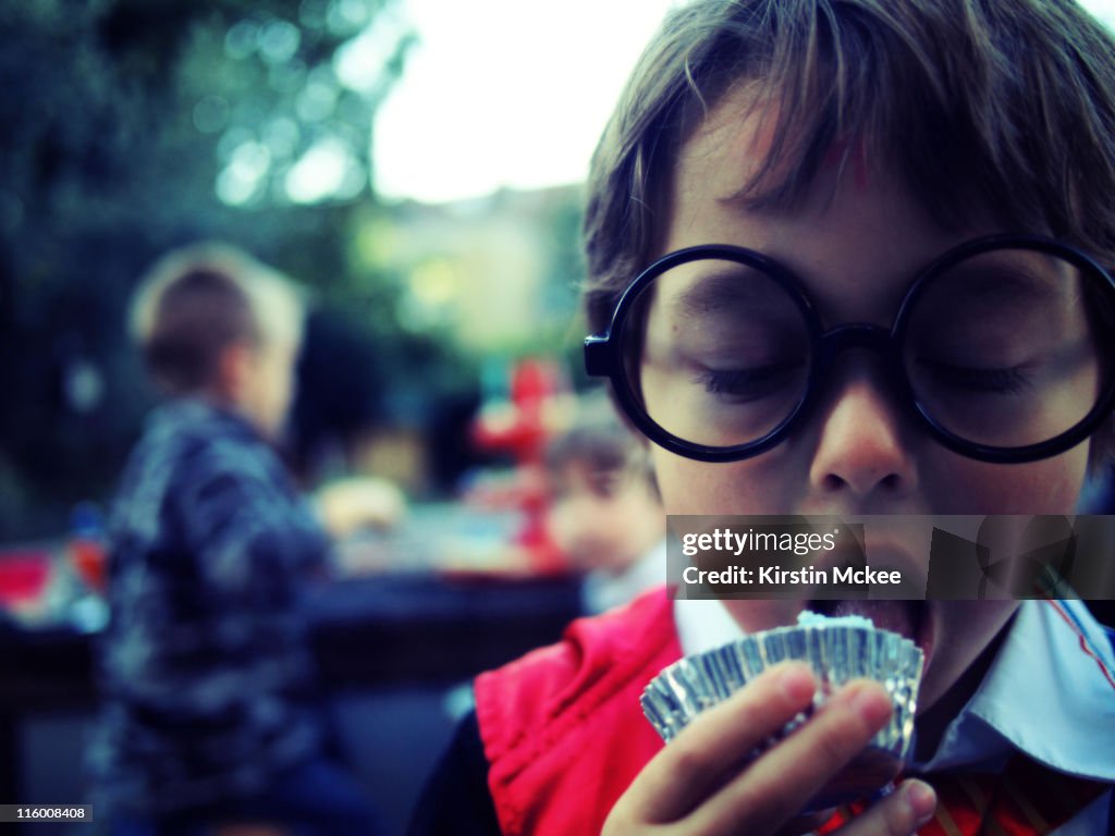 Boy eating cupcake