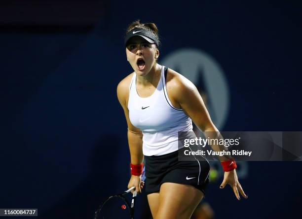 Bianca Andreescu of Canada celebrates a point against Eugenie Bouchard of Canada during in a first round match on Day 4 of the Rogers Cup at Aviva...