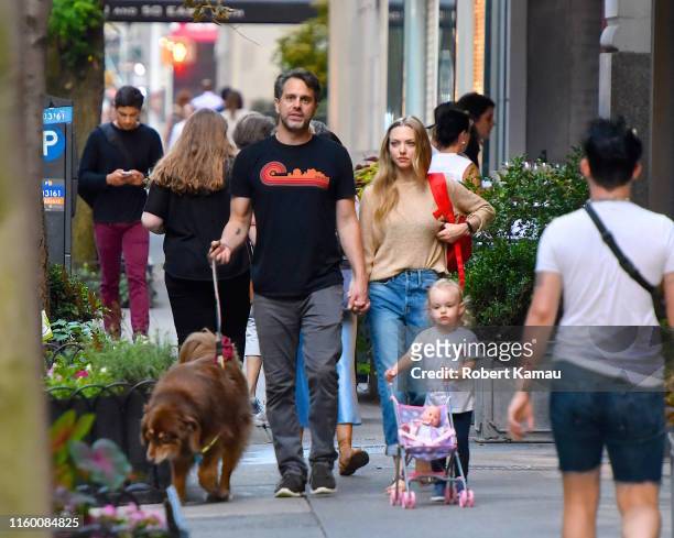 Amanda Seyfried, husband Thomas Sadoski, daughter Nina and their dog Finn seen out and about in Manhattan on August 6, 2019 in New York City.