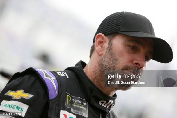 Jimmie Johnson, driver of the Ally Chevrolet, walks to his car during practice for the Monster Energy NASCAR Cup Series Coke Zero Sugar 400 at...