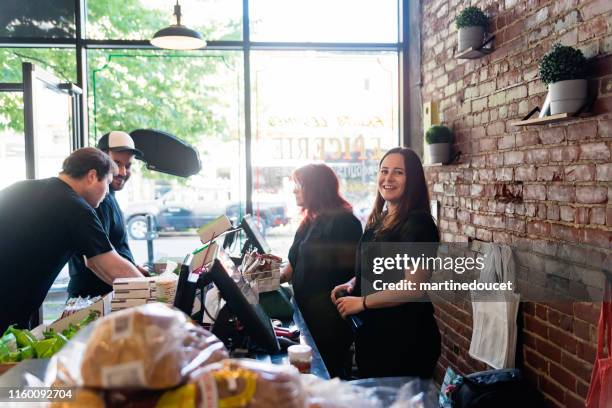 employees opening small zero waste oriented grocery store. - homegrown produce stock pictures, royalty-free photos & images