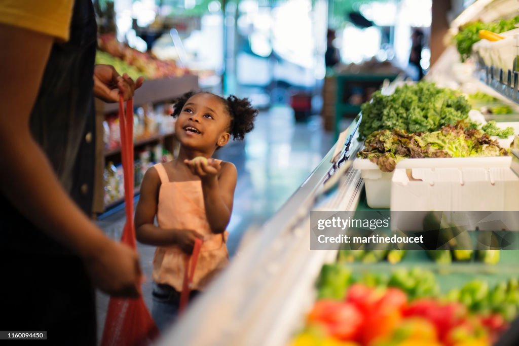 Customers in zero waste oriented fruit and grocery store.