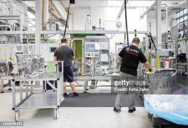 Brandenburg an der Havel, Germany Workers of the automotive supplier ZF Getriebe GmbH work in the factory hall, on July 25, 2019 in Brandenburg an...