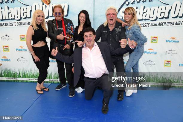 Antje Klann, Frank Zander, Sotiria , Olaf Schenk and Hans Orendt of the duo 'Olaf und Hans' and Annemarie Eilfeld attend the SchlagerOlymp press...