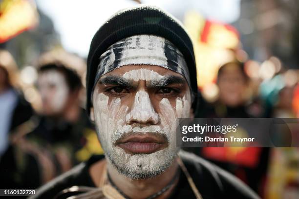 Man takes part in the annual NAIDOC march on July 05, 2019 in Melbourne, Australia. The march marks the start of NAIDOC Week, which runs in the first...