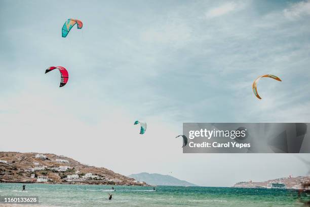 people enjoying kite surf on the beach - naxos stock-fotos und bilder