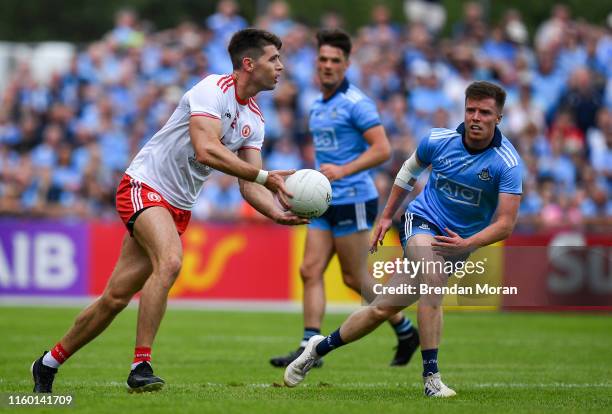 Tyrone , United Kingdom - 4 August 2019; Conan Grugan of Tyrone in action against Robert McDaid of Dublin during the GAA Football All-Ireland Senior...