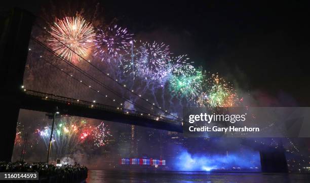 Fireworks are launched from the Brooklyn Bridge during Macy's Independence Day fireworks show on July 4, 2019 in New York City.