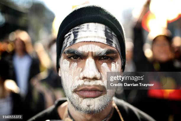 Man takes part in the annual NAIDOC march on July 05, 2019 in Melbourne, Australia. The march marks the start of NAIDOC Week, which runs in the first...