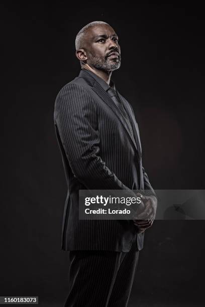 black gangster man - bodyguard muscle stock pictures, royalty-free photos & images