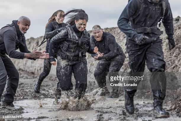 military mud run group - military training stock pictures, royalty-free photos & images