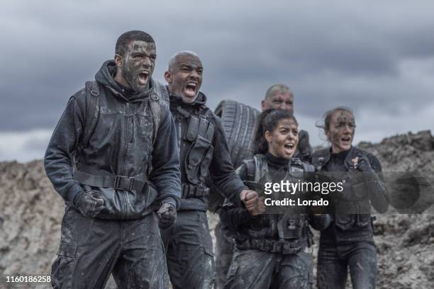military mud run group - training camp stock pictures, royalty-free photos & images