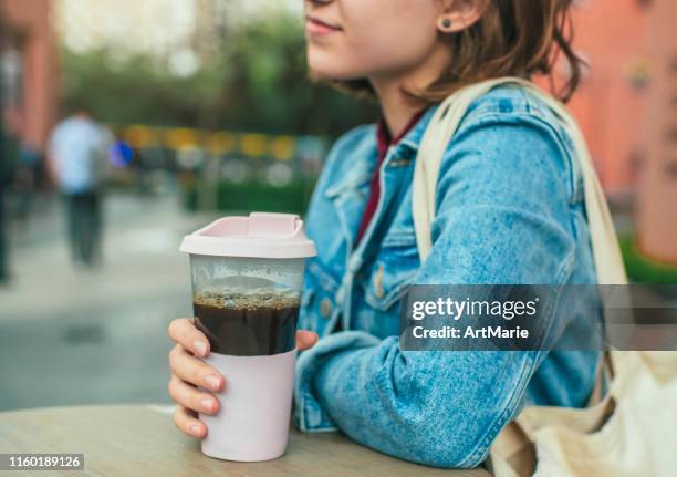 young woman with eco-friendly reusable coffee cup and cotton bag, zero waste concept - reusable cup stock pictures, royalty-free photos & images