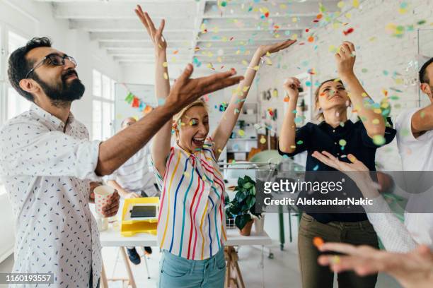 celebration in the office - celebration stock pictures, royalty-free photos & images