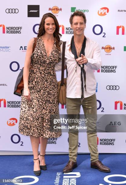 Kristina Hawkes and Chesney Hawkes attends the Nordoff Robbins O2 Silver Clef Awards 2019 at the Grosvenor House on July 05, 2019 in London, England.