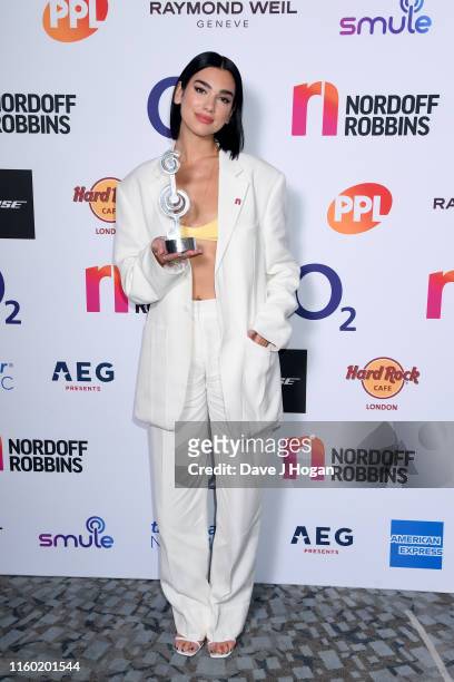 Dua Lipa poses with her award after winning Best Female during the Nordoff Robbins O2 Silver Clef Awards 2019 at Grosvenor House on July 05, 2019 in...