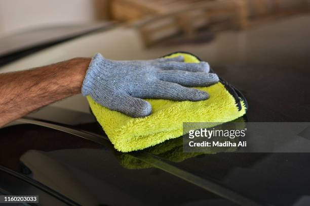 car detailing | detail | wax | dusting | protect | clean | terry cloth | brush | dirty | polish | shiny | black car - car wash brush fotografías e imágenes de stock