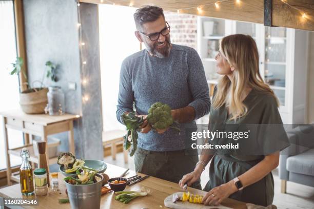 healthy food preparation - mature adult couples stock pictures, royalty-free photos & images