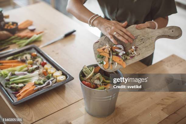 making compost from vegetable leftovers - waste stock pictures, royalty-free photos & images